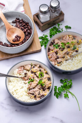 Overhead of two bowls of slow cooker shredded pork over rice