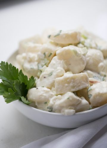 Potato salad in a white bowl