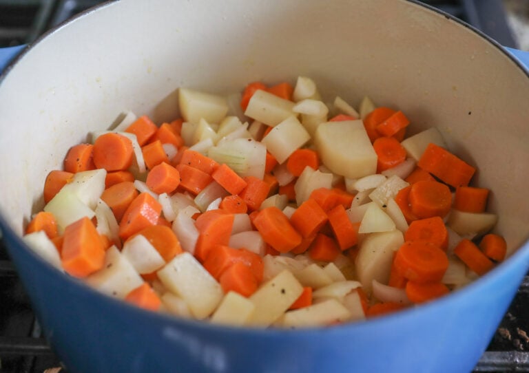 carrots, onion and potato in pot
