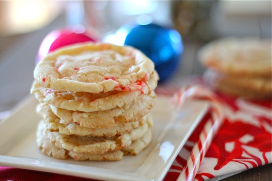 candy cane cookies stacked on top of each other on a white plate