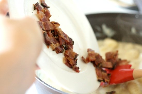 Adding cooked sliced bacon