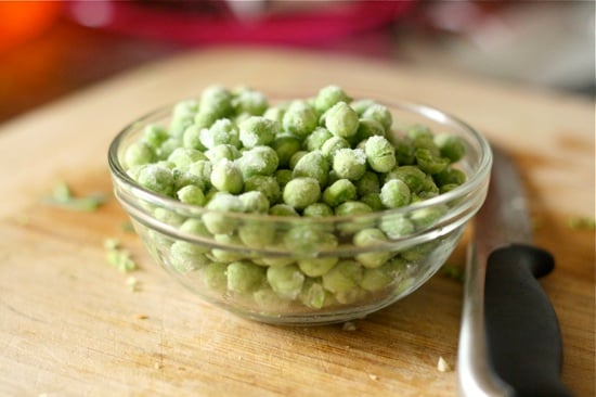 Frozen peas in a small glass bowl