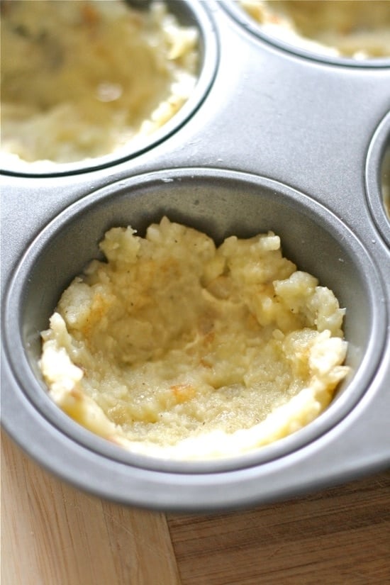 potato mixture in a muffin tin