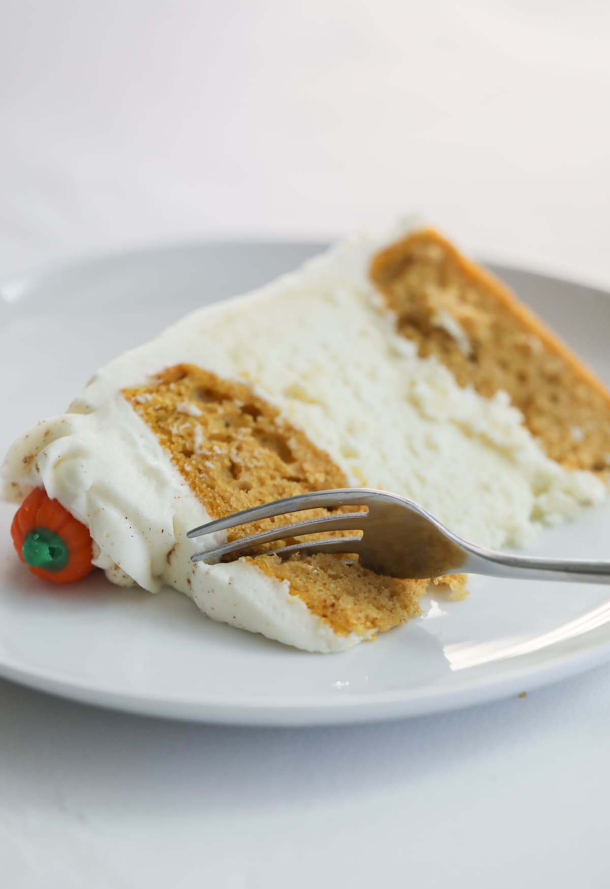 slice of pumpkin cake on white plate