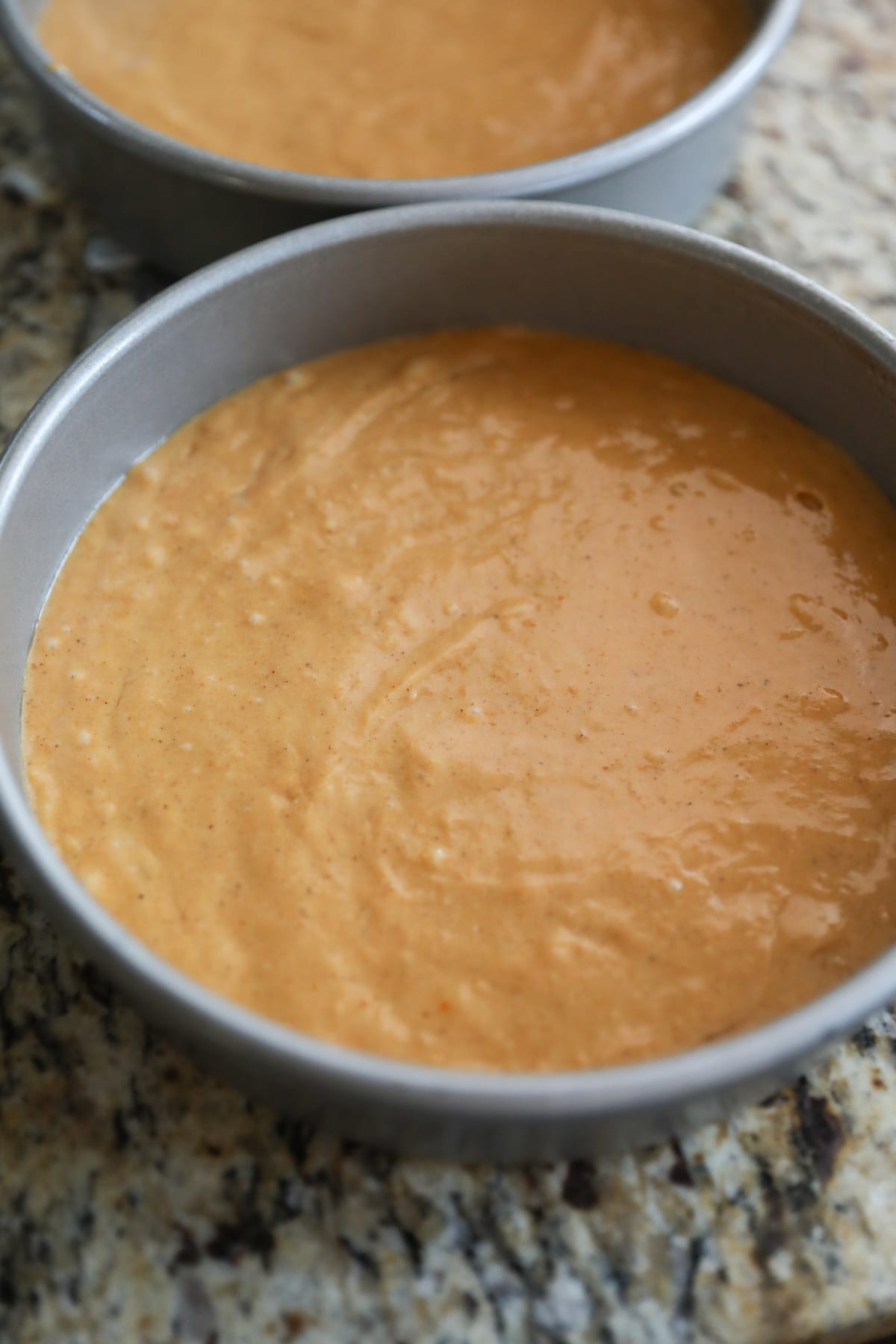 pumpkin cake batter in baking pan