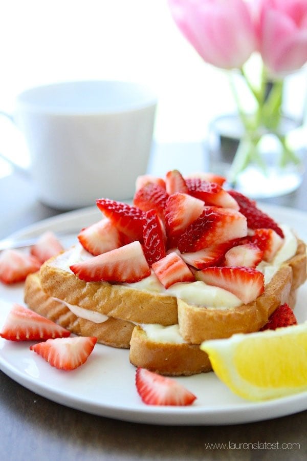 Lemon French Toast with lemon cream topping and sliced strawberries on top