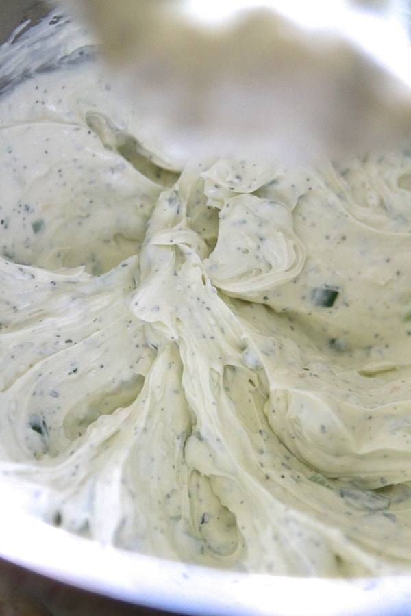 cream cheese, sour cream, green onions and ranch dressing mix, mixed together in a bowl