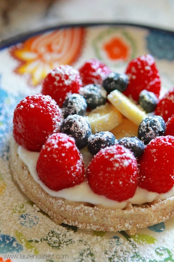 fruit waffle breakfast pizza with powdered sugar