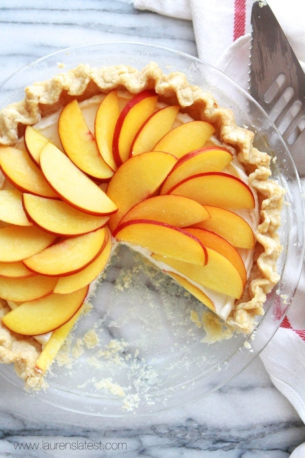 Peaches and cream pie with pieces missing