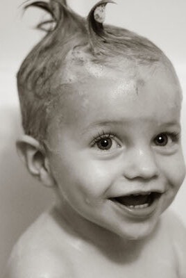 little boy with soapy wet hair
