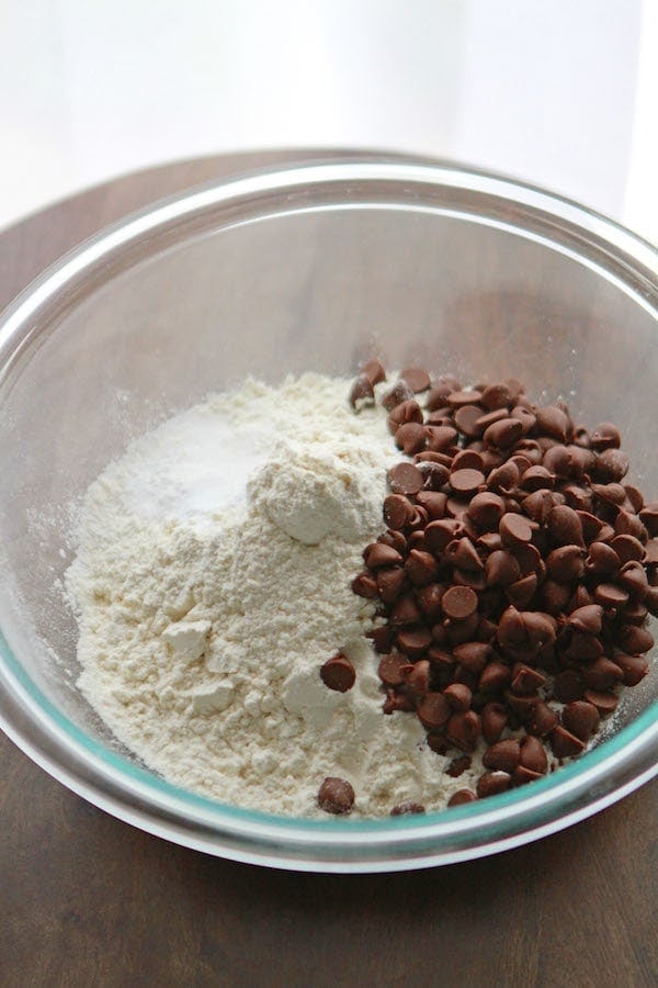dry ingredients and chocolate chips in a glass bowl