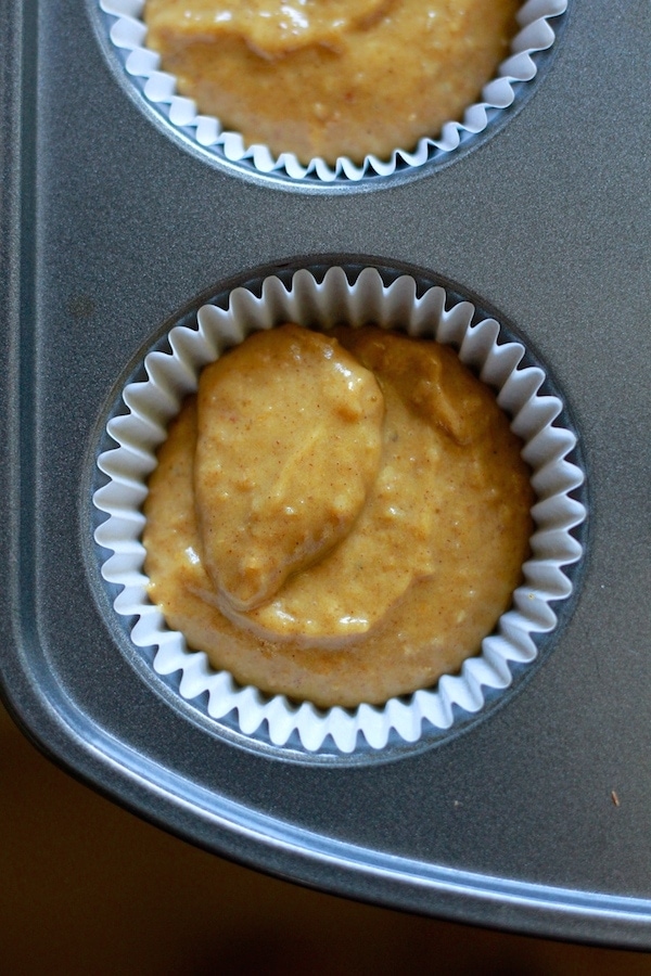 pumpkin bran muffin batter in muffin tin