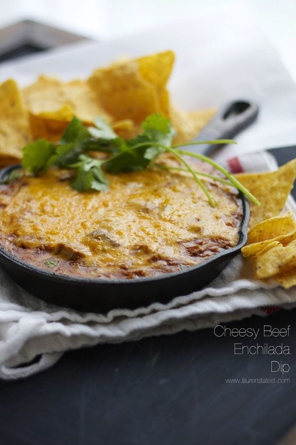 Enchilada Dip in a small skillet next to chips