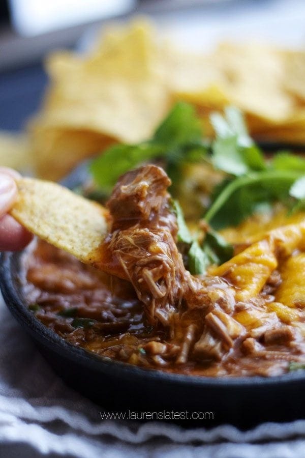 a chip scooping enchilada dip 