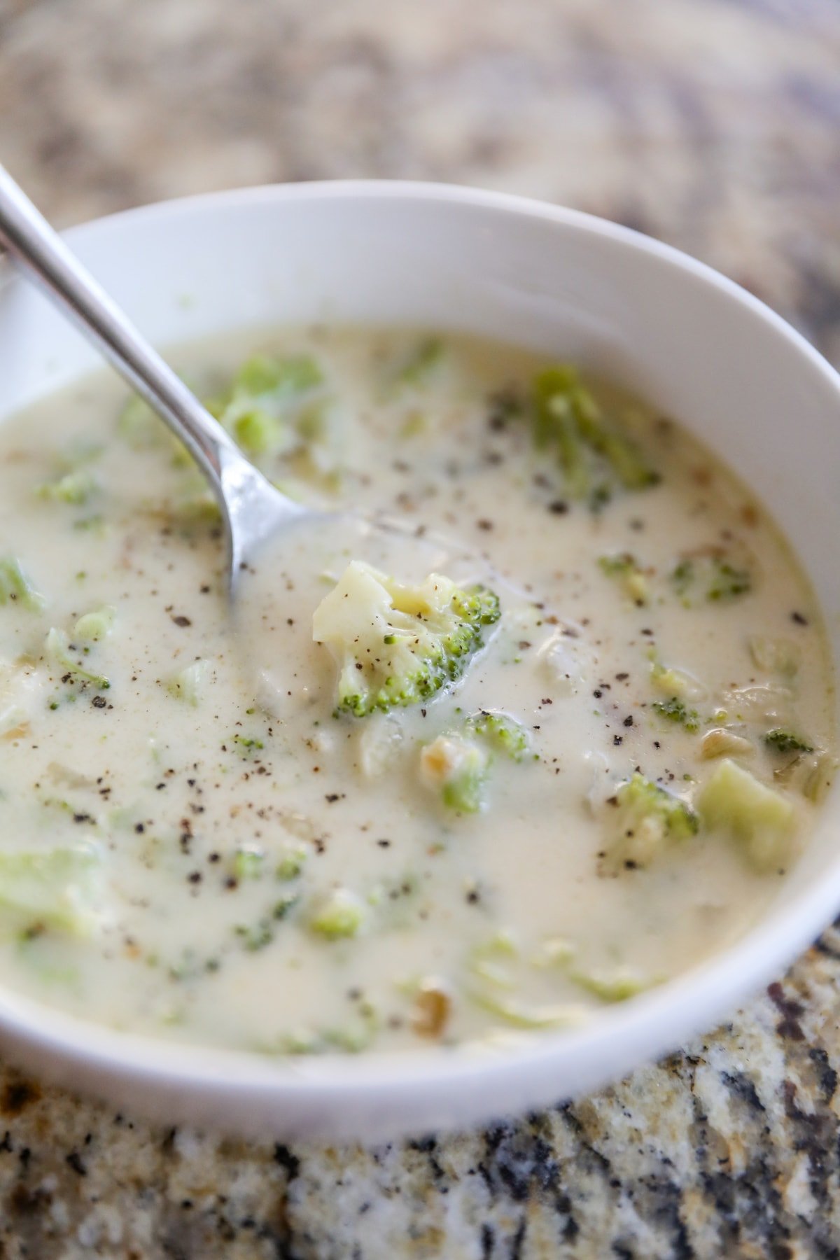 broccoli cheese soup in white bowl