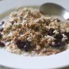 A bowl of muesli with cranberries and granola.