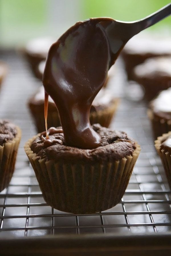 chocolate cupcake with pouring chocolate over the top