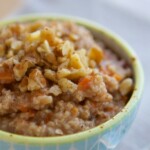 A bowl of Carrot Cake Oatmeal with nuts.