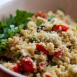 A Mediterranean Quinoa Salad with tomatoes and parsley.