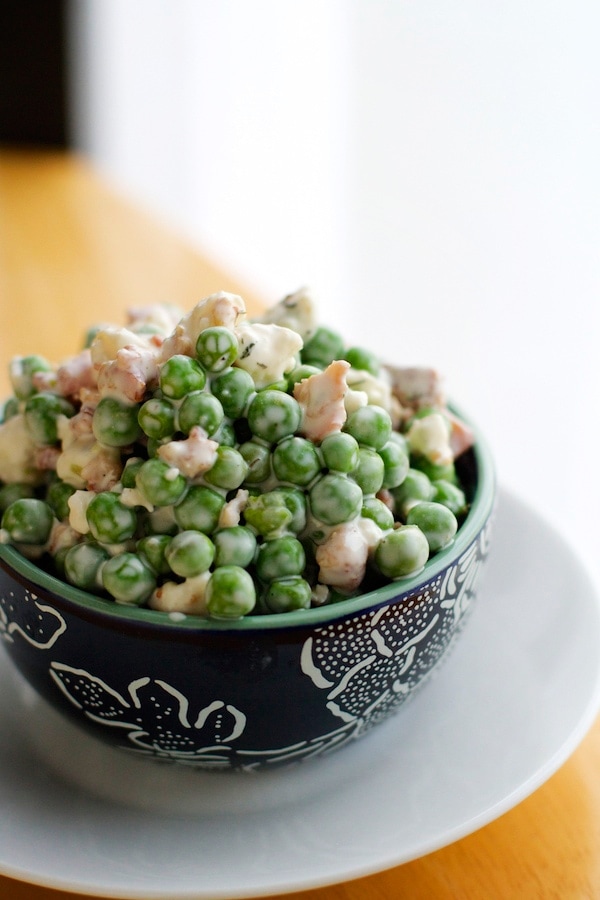 Pea salad in a dish on a platter.