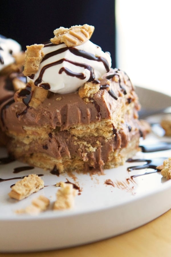 A stack of chocolate and peanut butter desserts on a plate.