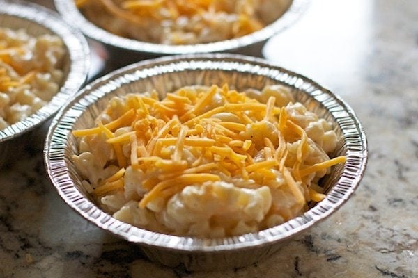 mac and cheese in a pie tin with cheese on top