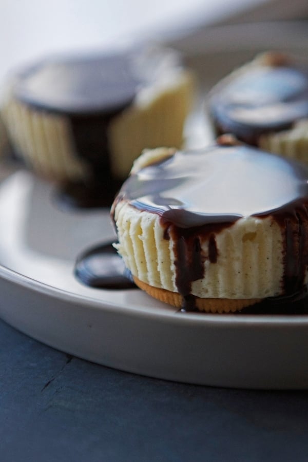 Mini Cheesecakes with chocolate sauce on top