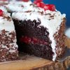 taking a slice of cake out of a black forest cake