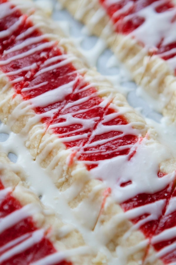 christmas shortbread cookies filled with jam and topped with icing