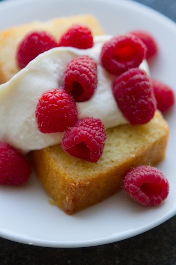 lemon butter cake with raspberries and whipped cream