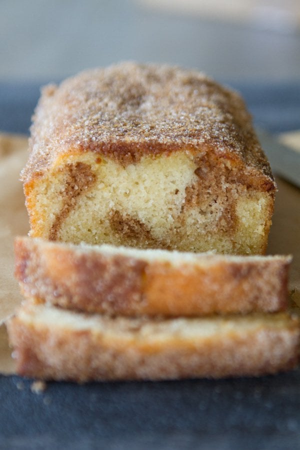 Cinnamon Swirl Donut Bread...A sweet cakey loaf with a delicious cinnamon swirl baked until perfection and then dipped into lots of butter and coated with cinnamon and sugar!! YESSSSS.