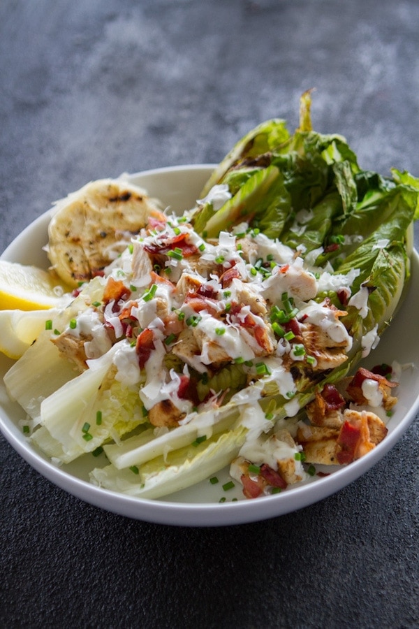 Grilled Chicken Caesar Salad in a white bowl
