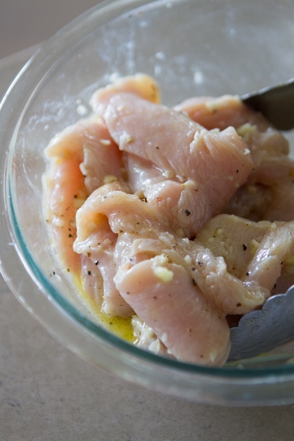 Raw Chicken with marinating in a bowl