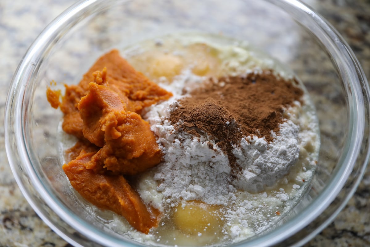 ingredients for pumpkin cake in glass bowl