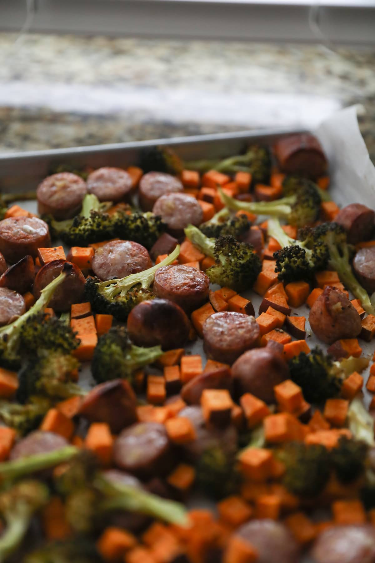 sheet pan with roasted sausages and vegetables