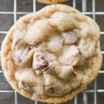 close up of a chocolate chip cookie on a cooling wrack