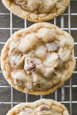 close up of a chocolate chip cookie on a cooling wrack