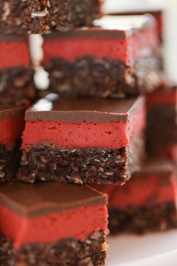 Red Velvet Nanaimo Bars stacked on top of each other
