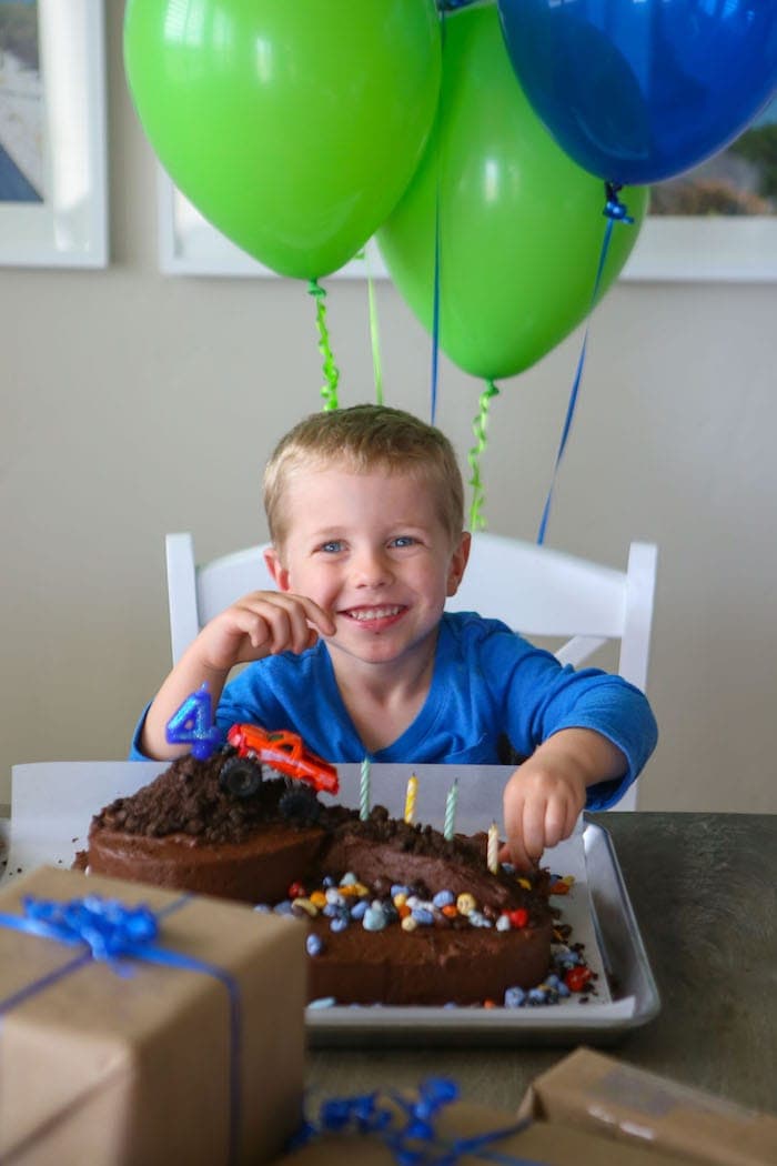 Blake sitting in front of his cake