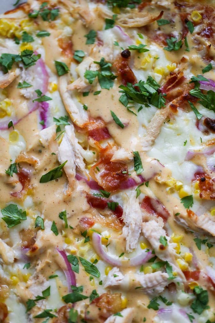 close up of bbq chicken pizza with smokey blue sauce