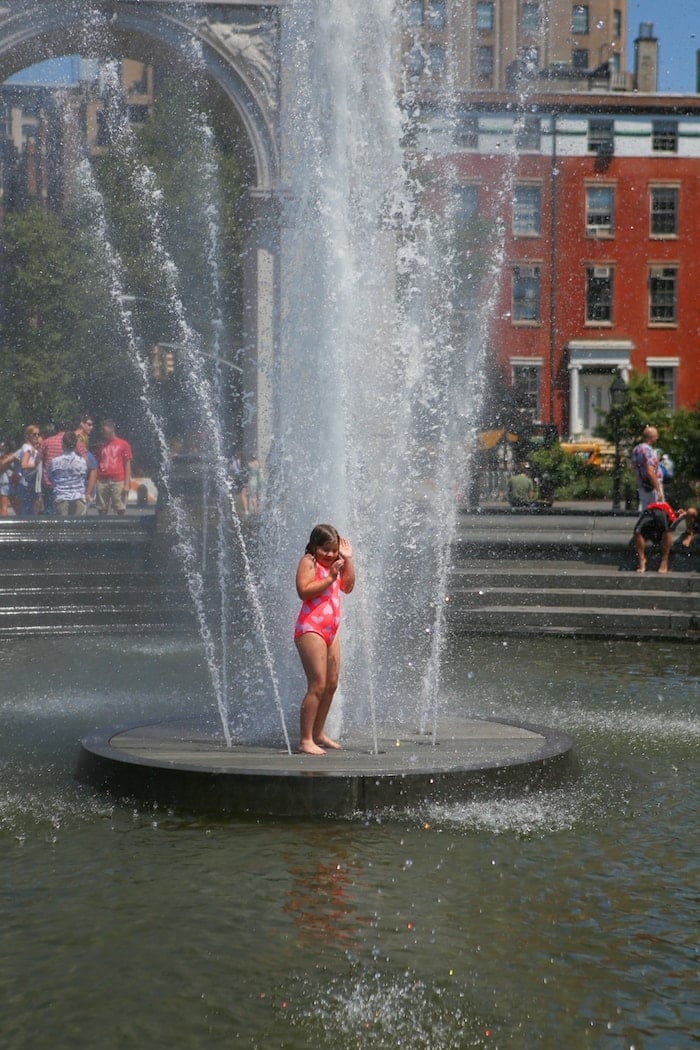 A fountain with people in the water