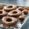 Pumpkin Donuts with glaze on drying rack
