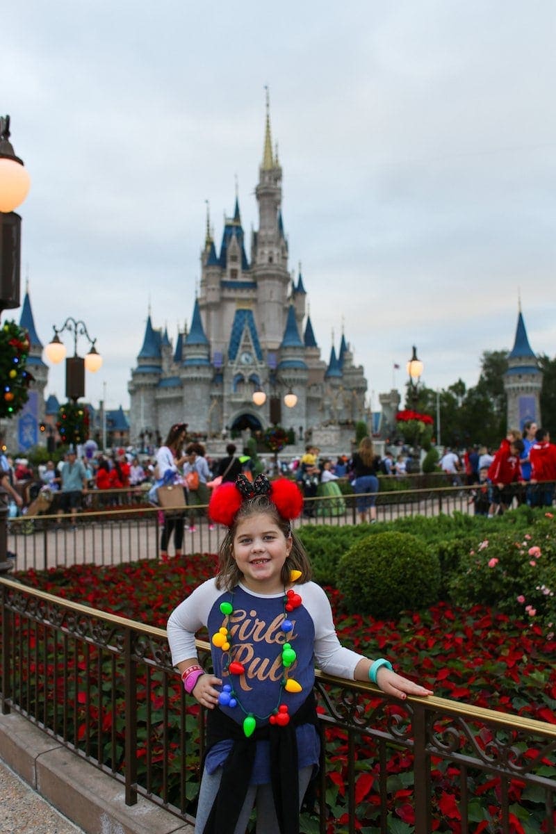 Brooke posing in front of Disney castle
