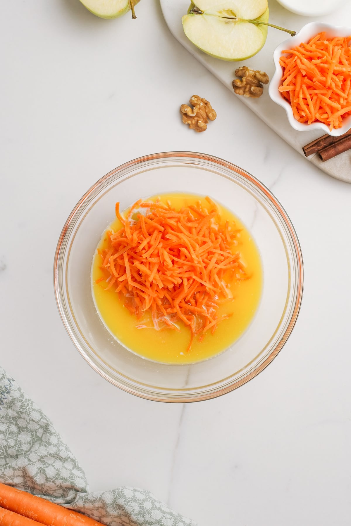 shredded carrots and eggs in a glass bowl