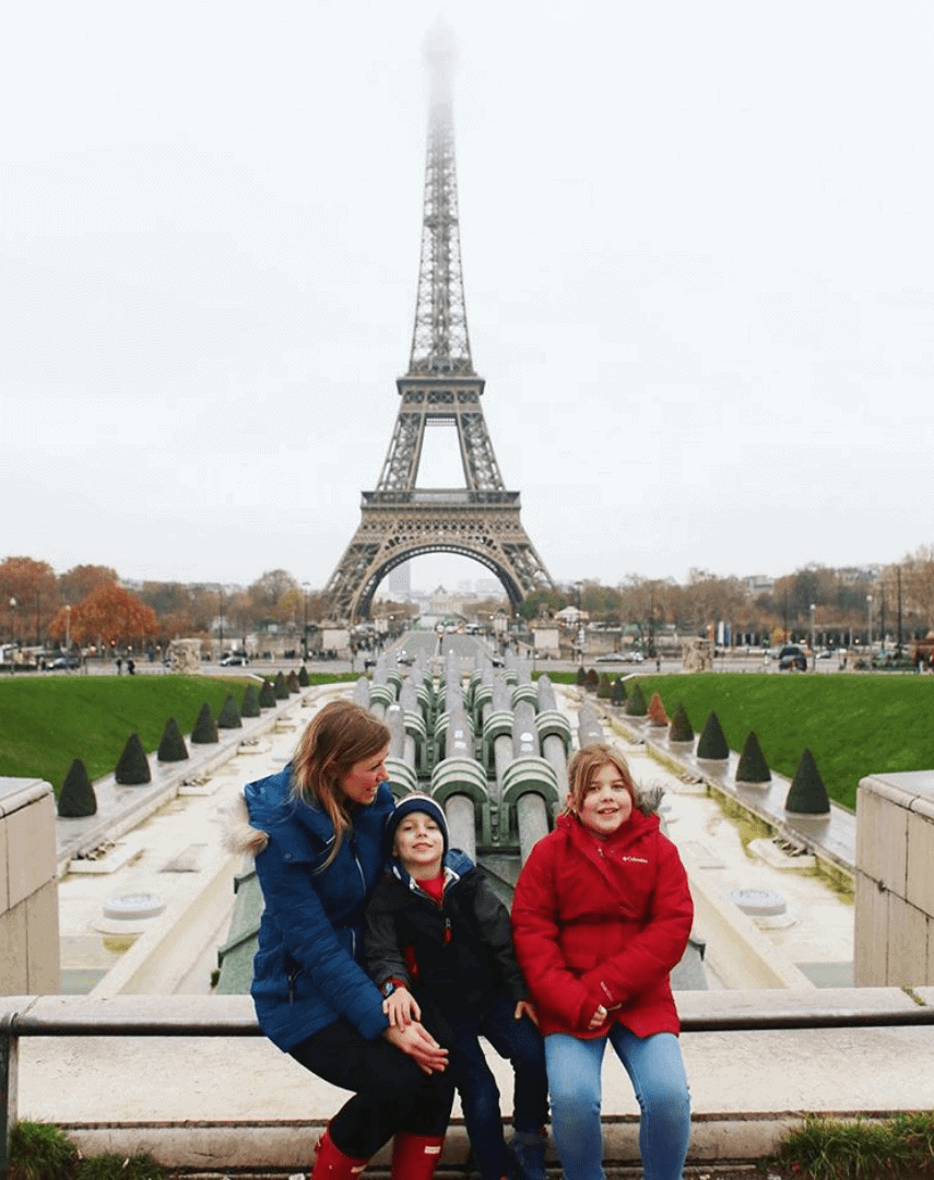 Lauren and the kids in front of the Eiffel Tower