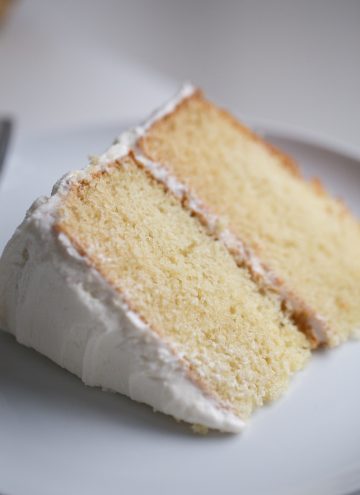 Slice of Vanilla Cake on white plate