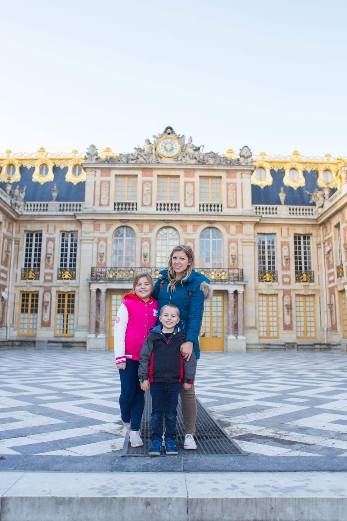 Lauren and kids in front of palace