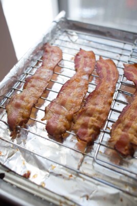 cooked bacon on baking sheet with rack