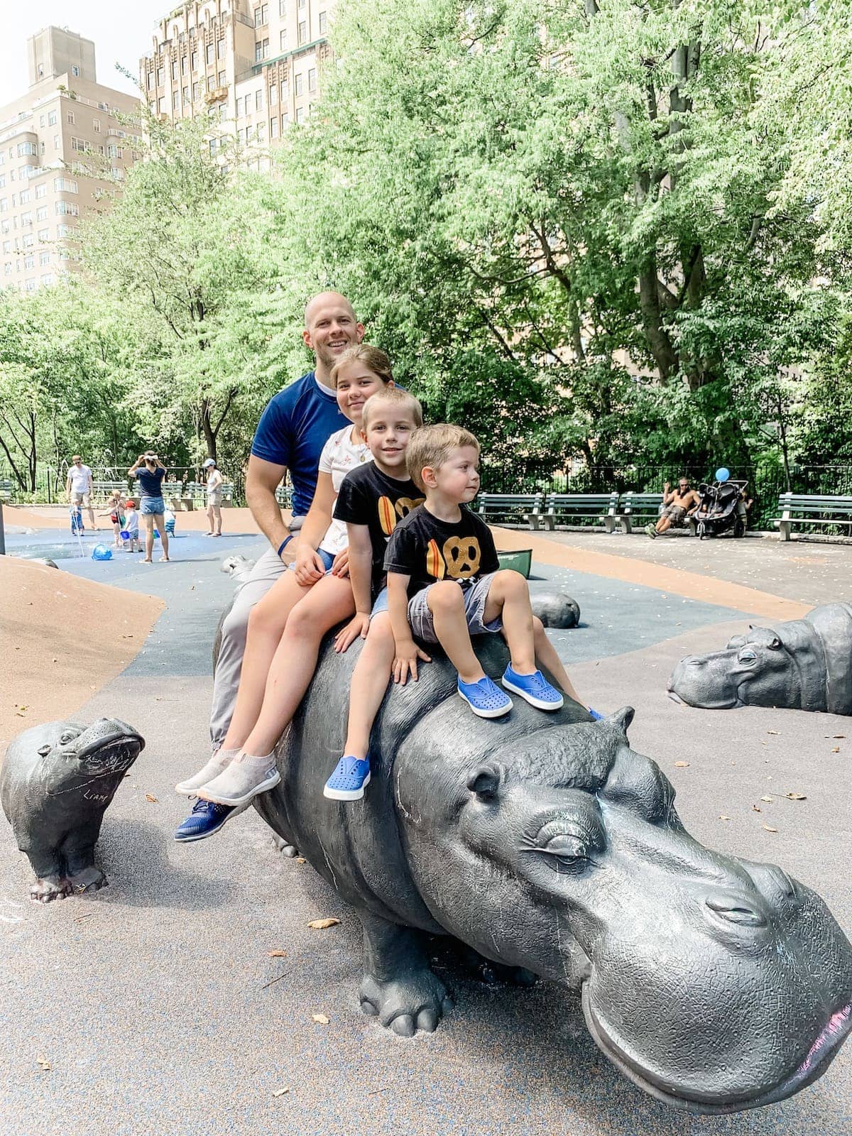Gordon and kids sitting on statue