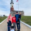 Brennan family in front of a lighthouse